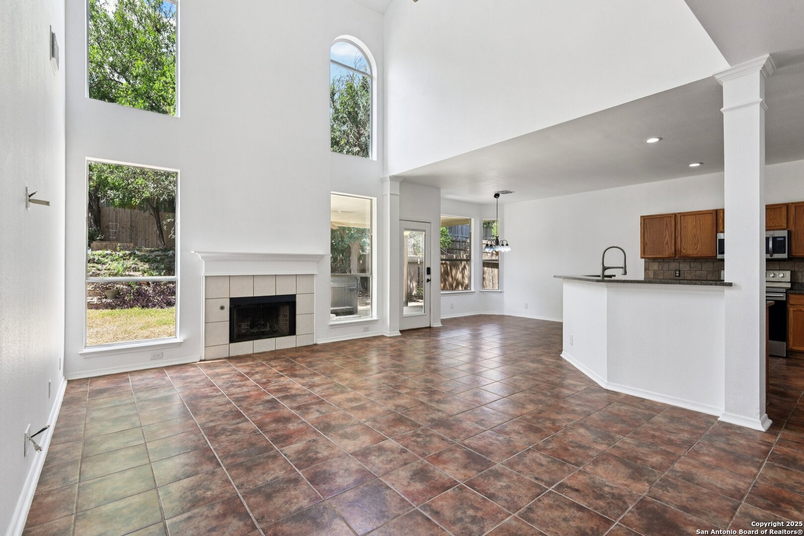 21510 Rio Colorado San Antonio, TX 78259 - Photo 12 of 42 a view of empty room with kitchen view and a window