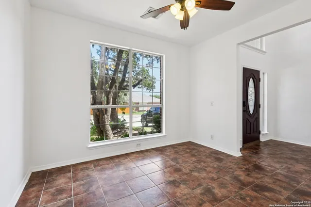 a view of an empty room with a window