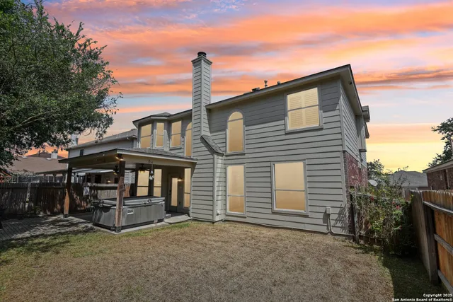 an aerial view of multiple houses with outdoor space