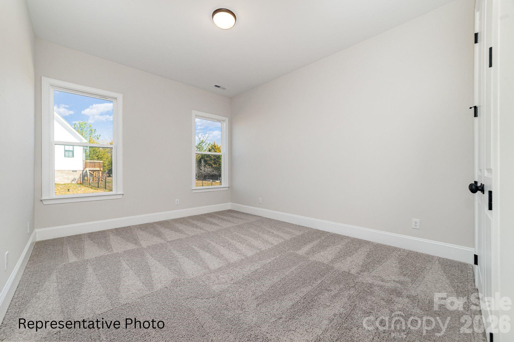 0 Rivendell Road, Unit 40 Denver, NC 28037 - Photo 15 of 23 an empty room with windows