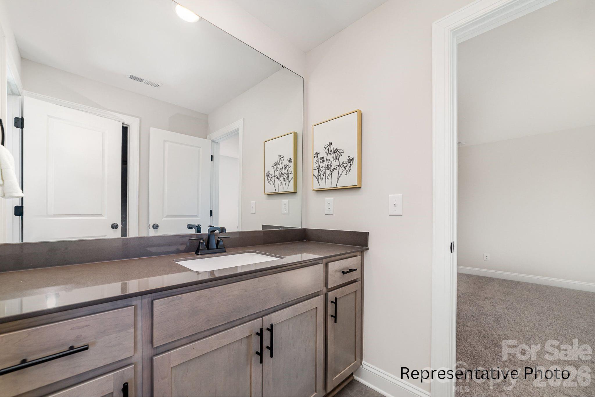 0 Rivendell Road, Unit 40 Denver, NC 28037 - Photo 16 of 23 a bathroom with a sink and a mirror