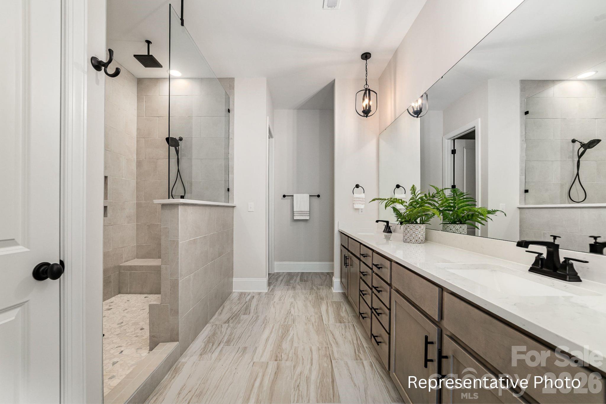 0 Rivendell Road, Unit 40 Denver, NC 28037 - Photo 10 of 23 a spacious bathroom with a double vanity sink a mirror and shower