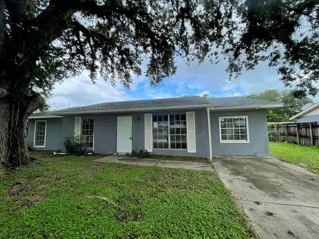 front view of a house with a yard