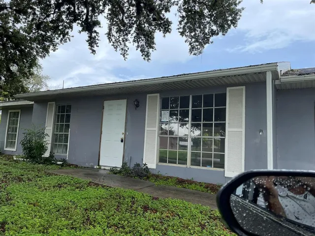 front view of a house with a garden