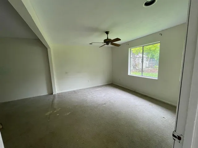 a bathroom with a toilet a sink and shower