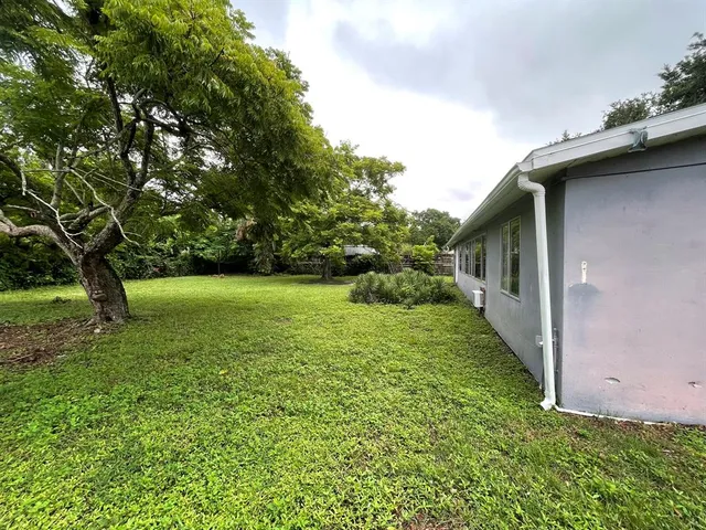a backyard of a house with lots of green space