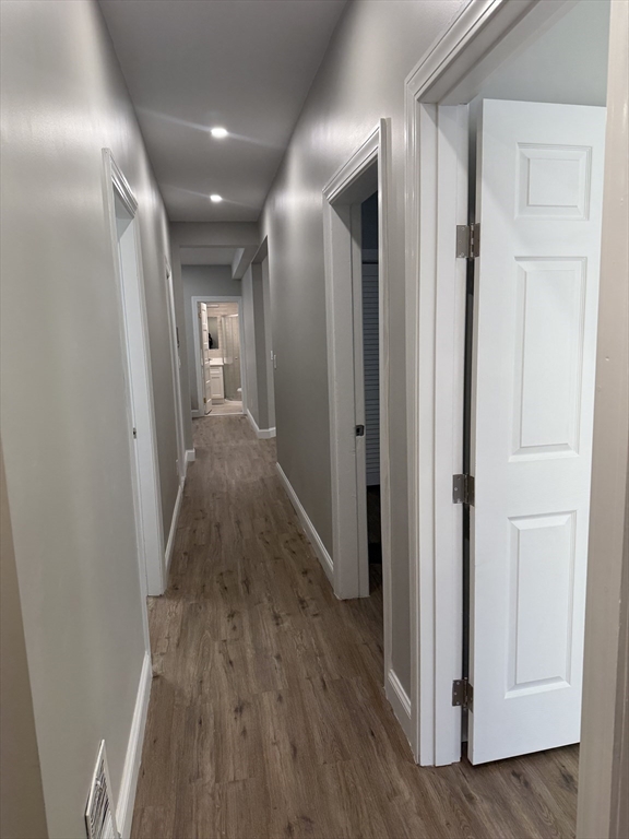 19 Dewolf Street, Unit 1 Boston, MA 02125 - Photo 11 of 12 a view of hallway with wooden floor