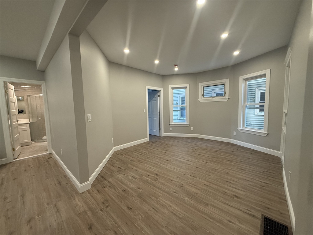 19 Dewolf Street, Unit 1 Boston, MA 02125 - Photo 5 of 12 a view of livingroom with hardwood floor and hallway