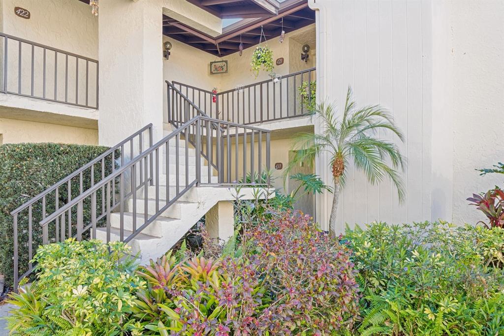 700 Starkey Road, Unit 411 Largo, FL 33771 - Photo 1 of 1 Building is surrounded by lush landscaping.
