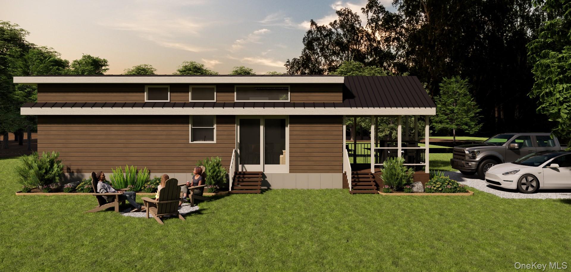 197 Wheeler Road, Unit 90 Florida, NY 10921 - Photo 2 of 37 View of side with a yard and a metal roof