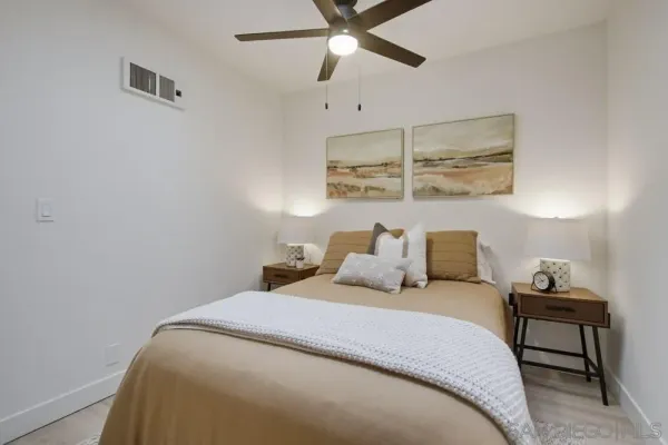 a bedroom with a bed and window