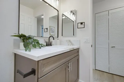 a bathroom with a sink and a mirror