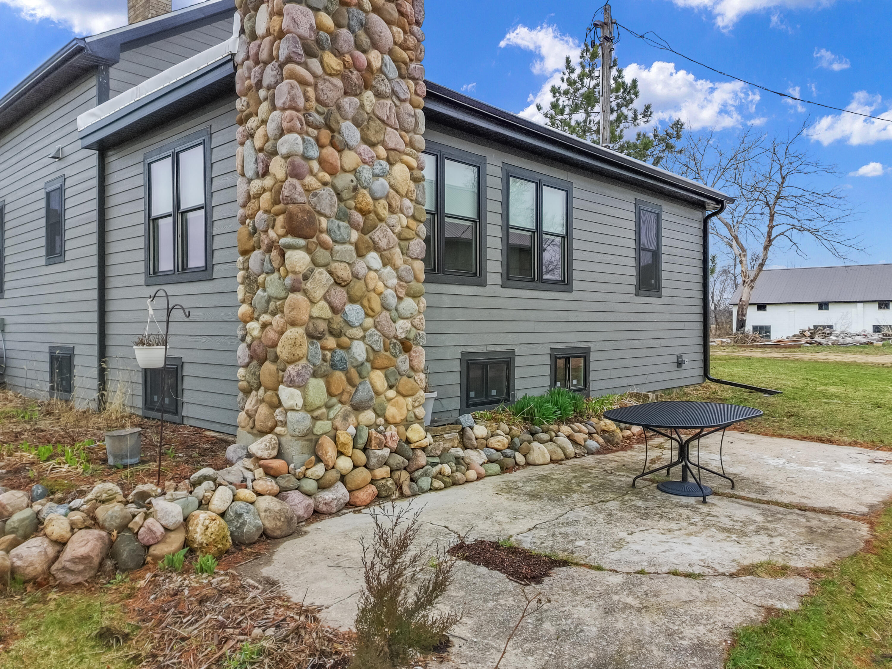 W6660 Willow Bend Road Walworth, WI 53184 - Photo 40 of 47 side elevation/patio