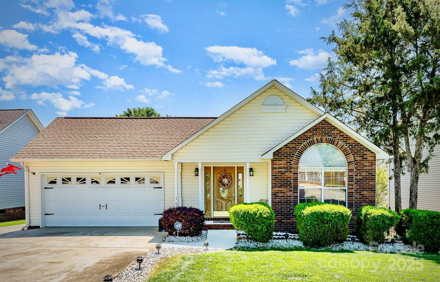a front view of a house with garden