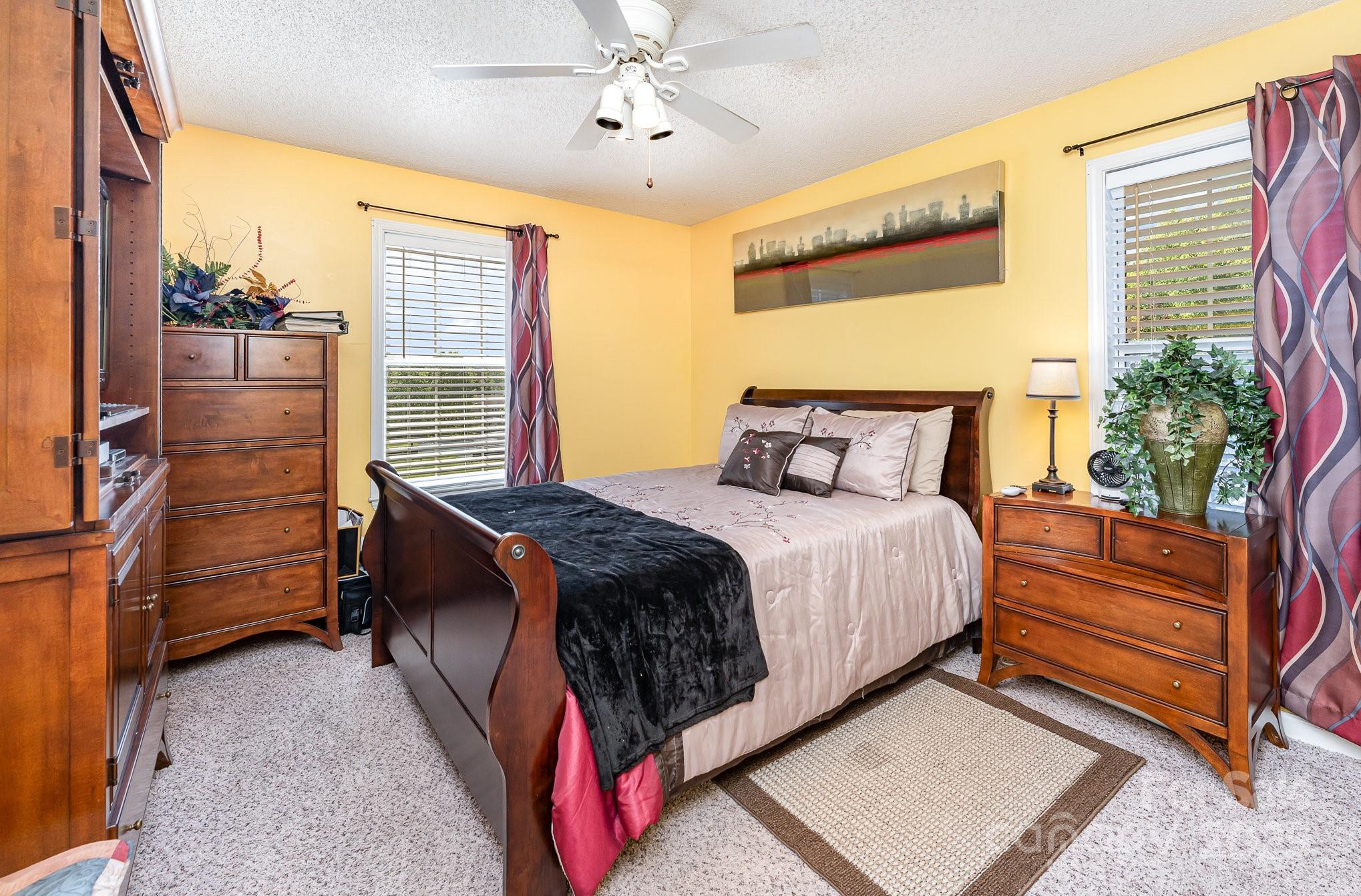 1076 Braxton Drive Concord, NC 28025 - Photo 12 of 20 a bedroom with a bed and a window