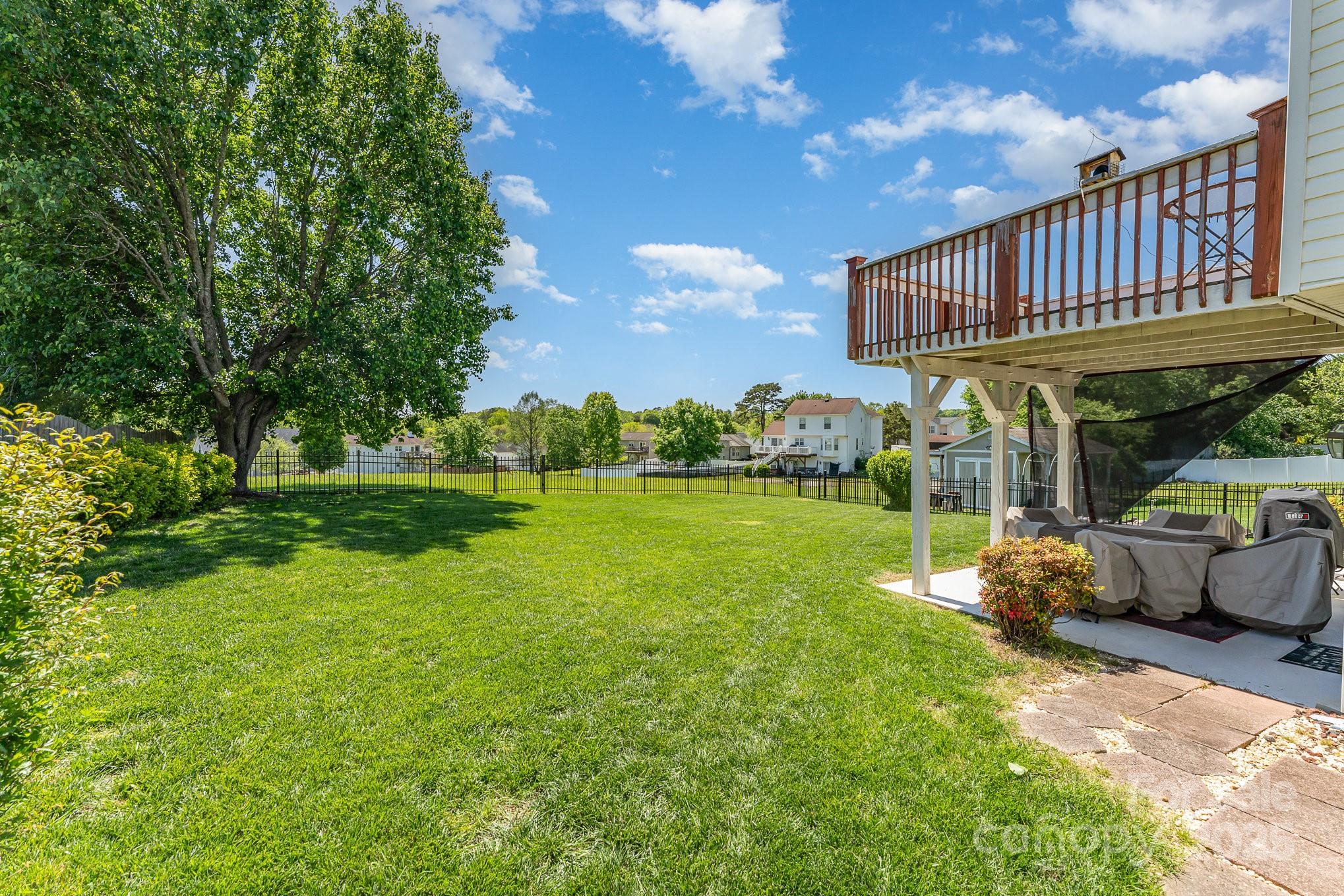 1076 Braxton Drive Concord, NC 28025 - Photo 17 of 20 a view of a house with backyard and a patio