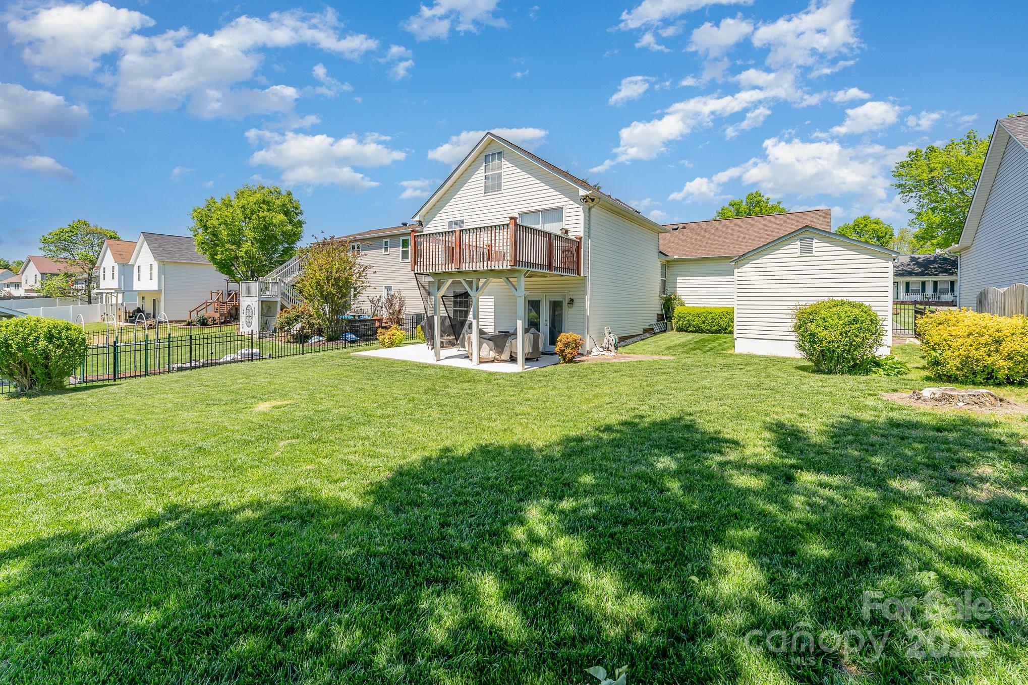 1076 Braxton Drive Concord, NC 28025 - Photo 2 of 20 a front view of a house with a yard and garage
