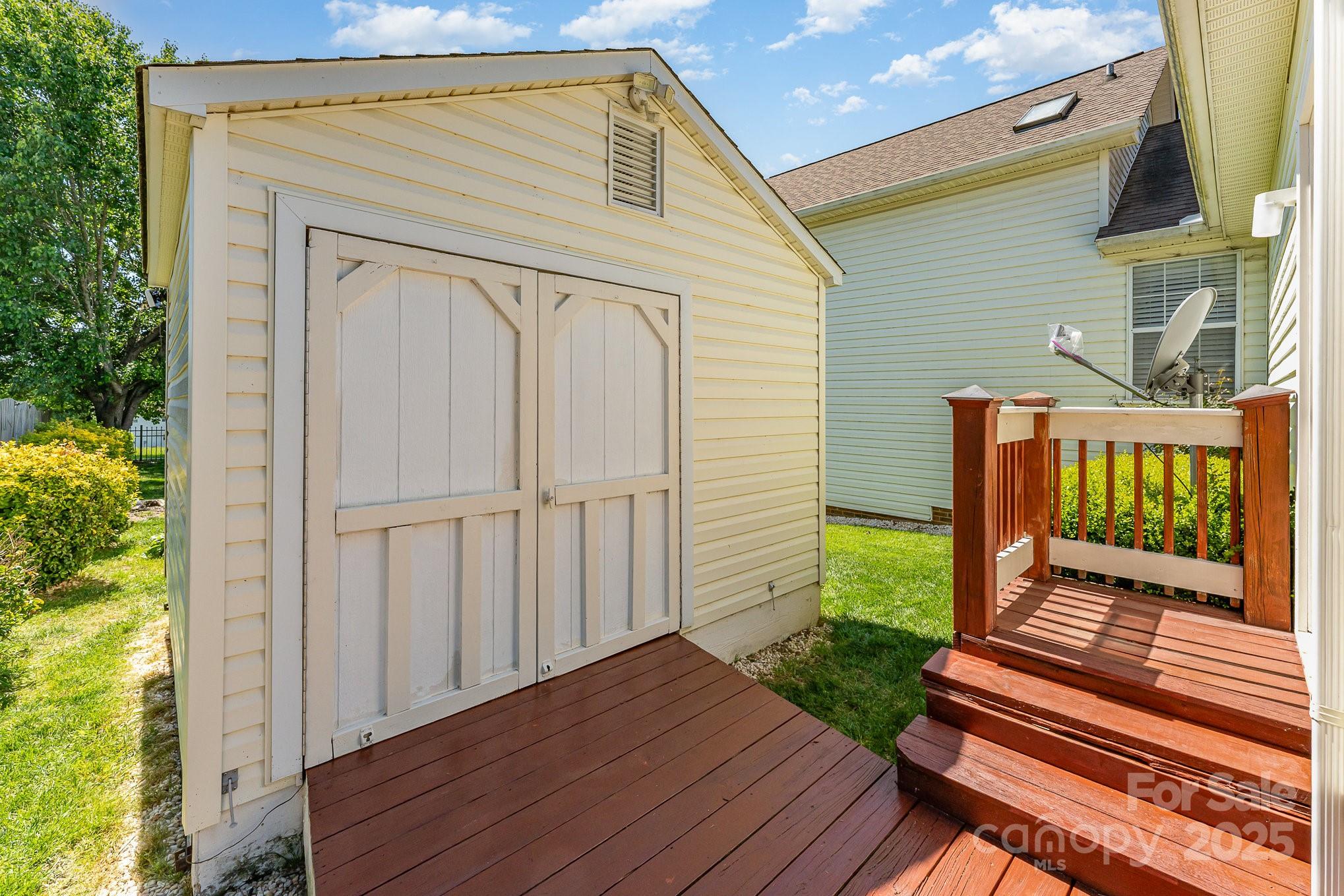 1076 Braxton Drive Concord, NC 28025 - Photo 3 of 20 a porch with seating space