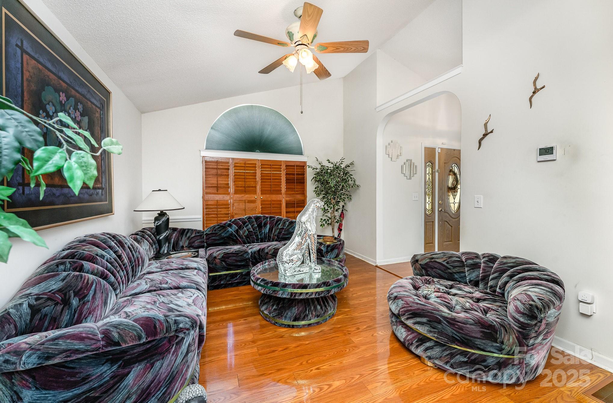 1076 Braxton Drive Concord, NC 28025 - Photo 4 of 20 a living room with furniture and a large window