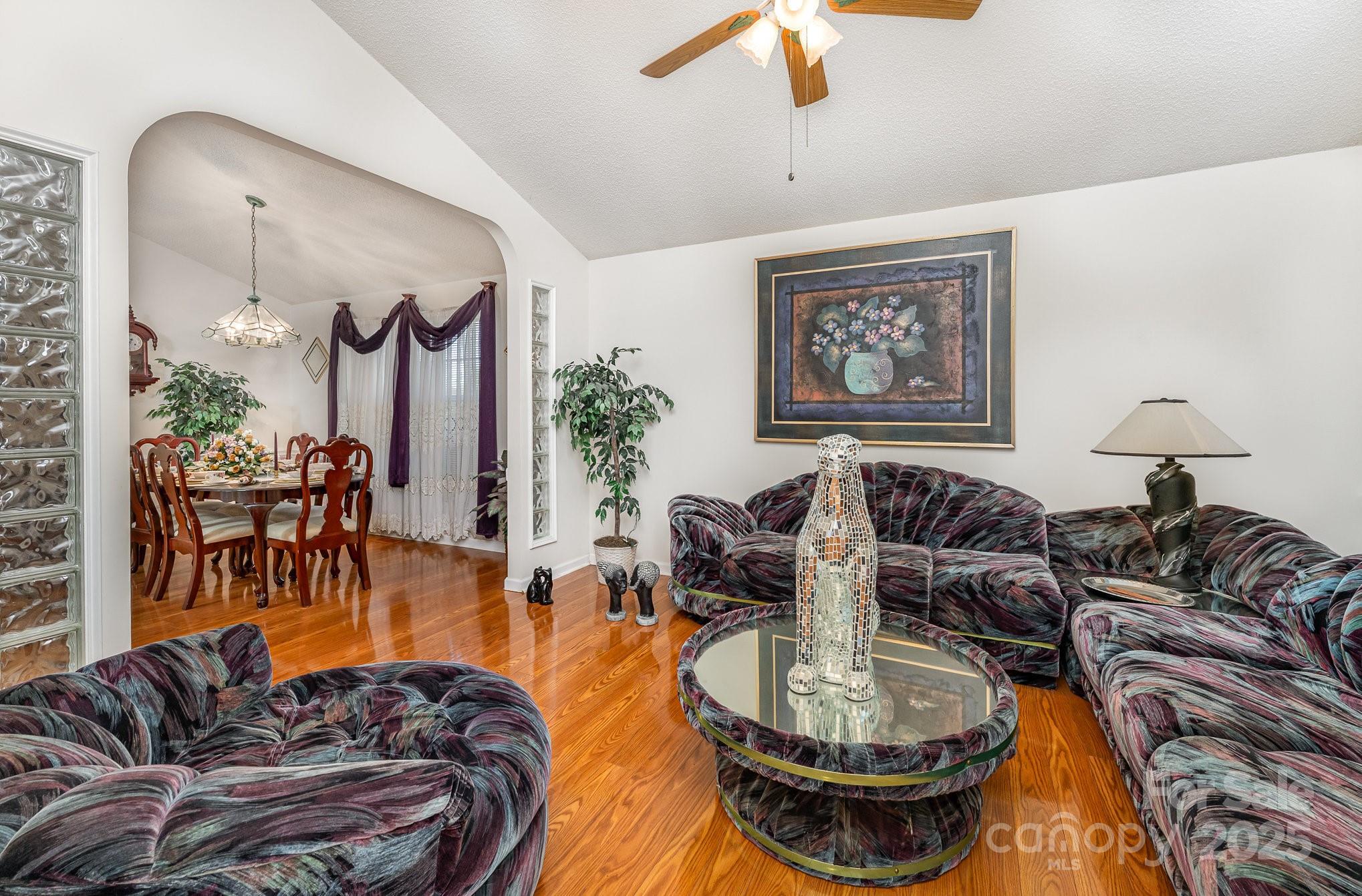 1076 Braxton Drive Concord, NC 28025 - Photo 5 of 20 a living room with furniture and a large mirror
