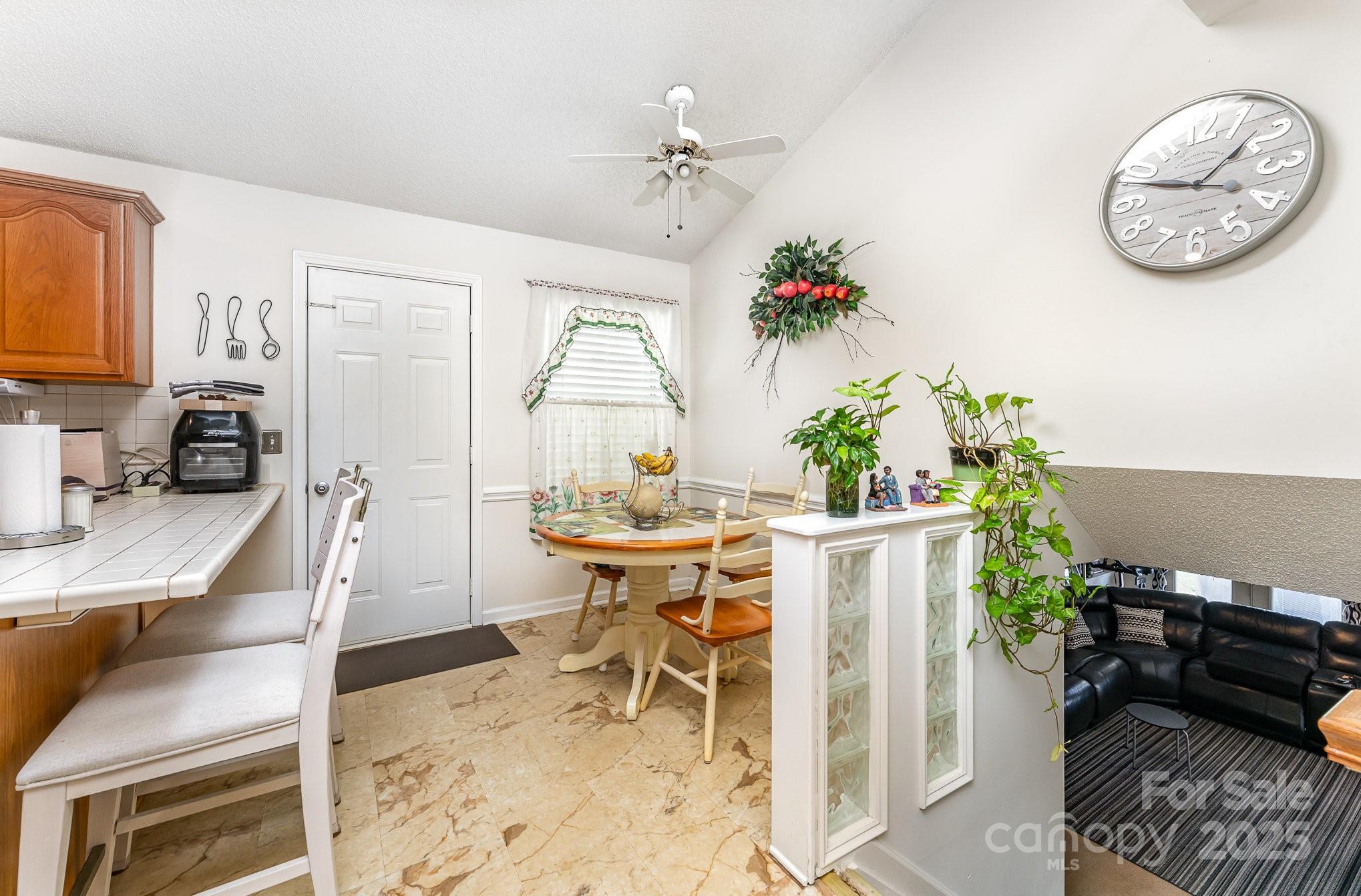 1076 Braxton Drive Concord, NC 28025 - Photo 9 of 20 a view of a dining room with furniture