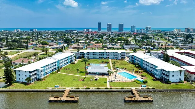 a living room with furniture rug and a table