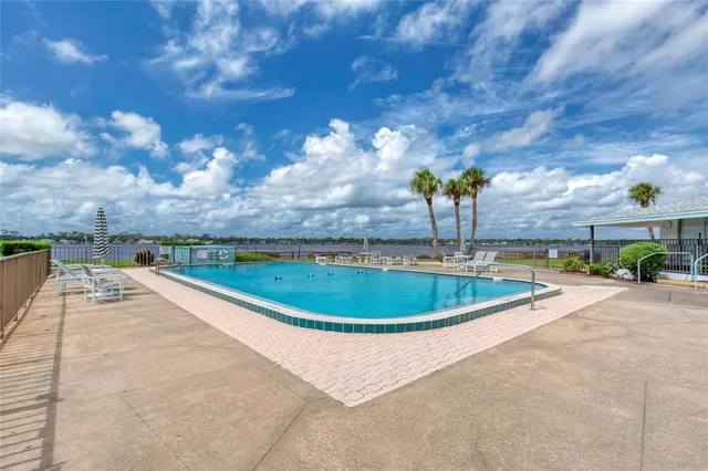 a view of a swimming pool with a patio