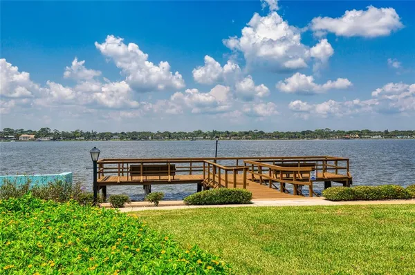 a yellow room with furniture and a chandelier