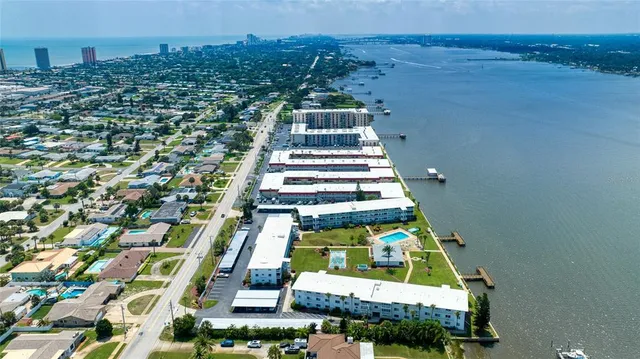 a view of a lake with a building in the background