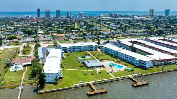 an aerial view of residential houses with outdoor space