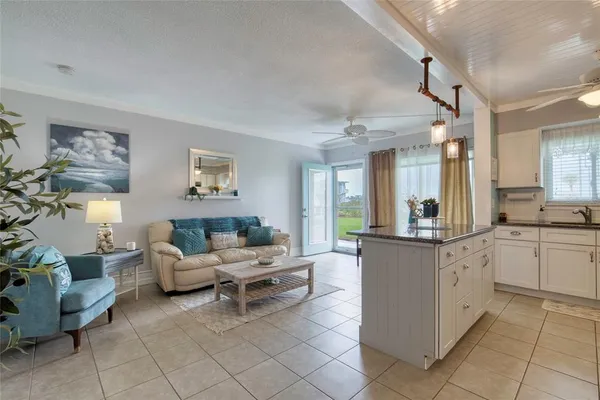 a kitchen with a cabinets and chairs