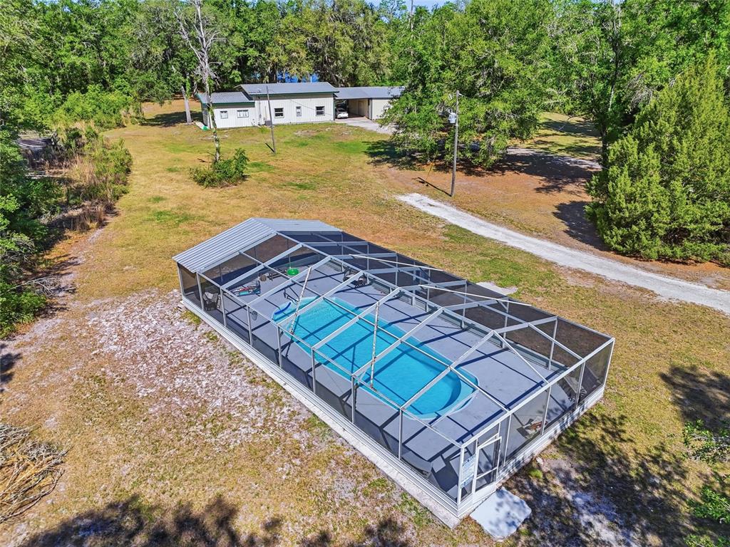 401 Southeast Falcon Road Branford, FL 32008 - Photo 2 of 76 a view of a backyard with swimming pool
