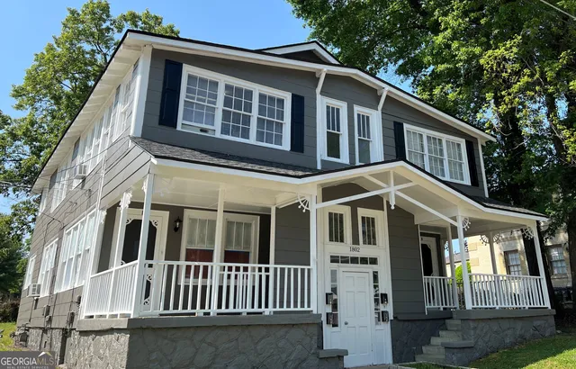 a front view of a house with yard