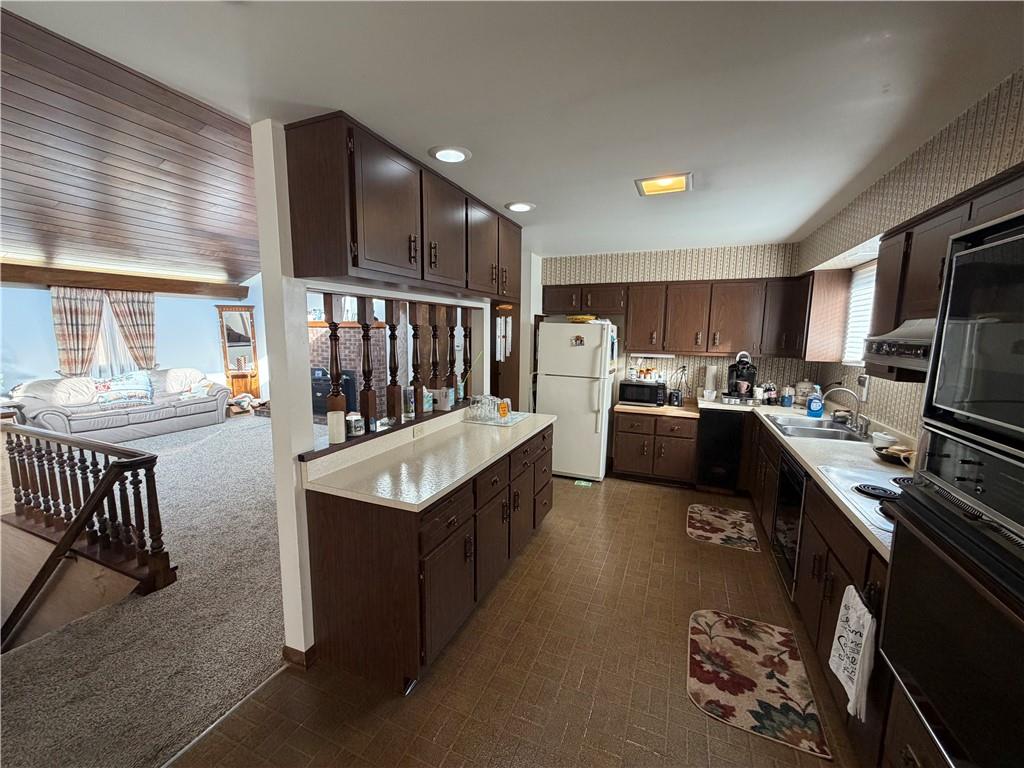 149 Chess Street Monongahela, PA 15063 - Photo 12 of 35 a kitchen with stainless steel appliances granite countertop a sink a stove and a refrigerator