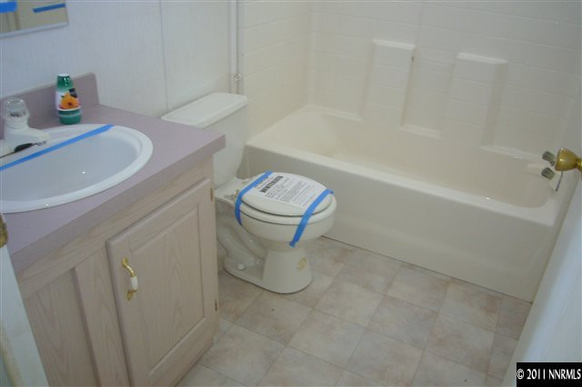 5990 Sarah Road Fallon, NV 89406 - Photo 6 of 12 a bathroom with a sink a toilet and bathtub