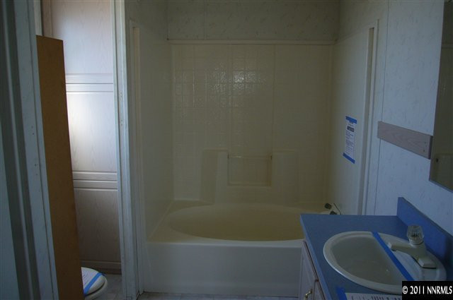 5990 Sarah Road Fallon, NV 89406 - Photo 8 of 12 a bathroom with a sink and a mirror
