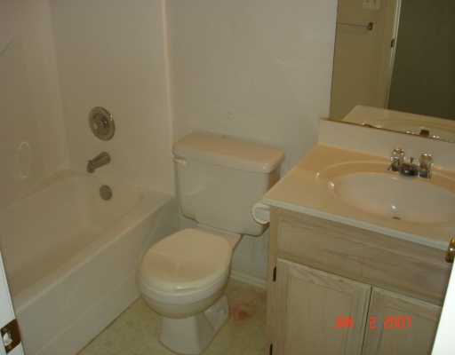 7801 Wolf Drive Corpus Christi, TX 78414 - Photo 5 of 6 a white toilet sitting next to a bath tub