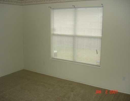 7801 Wolf Drive Corpus Christi, TX 78414 - Photo 6 of 6 an empty room with a window