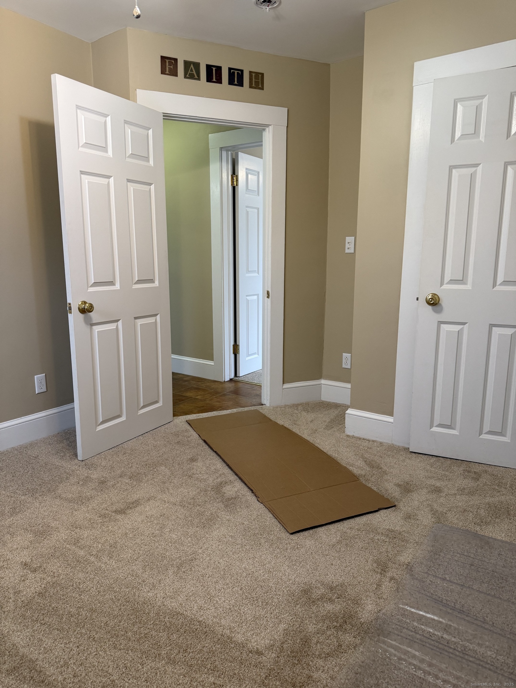 255 Main Street Plymouth, CT 06786 - Photo 13 of 14 an empty room with closet and mirror