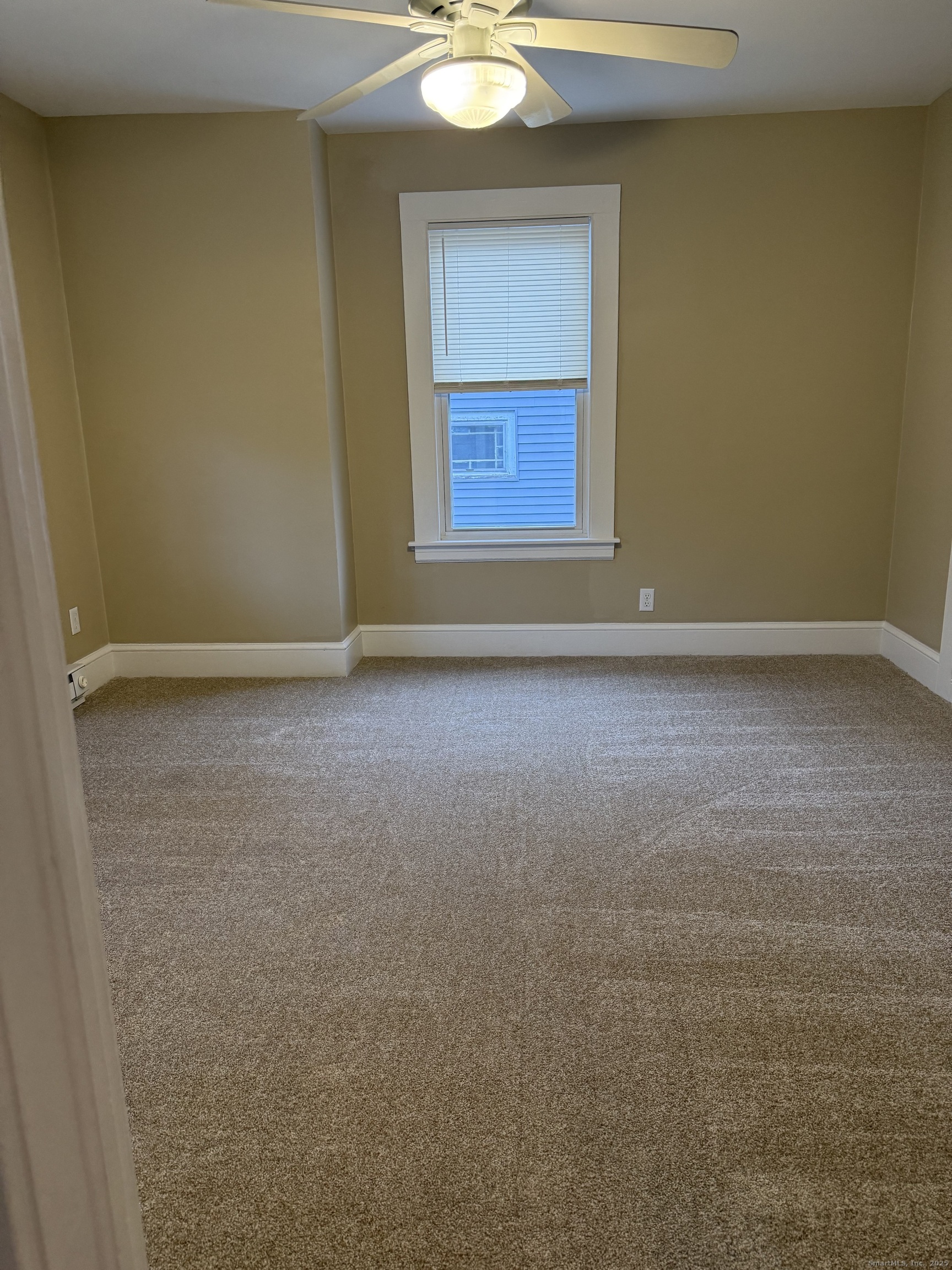 255 Main Street Plymouth, CT 06786 - Photo 5 of 14 a view of an empty room and window