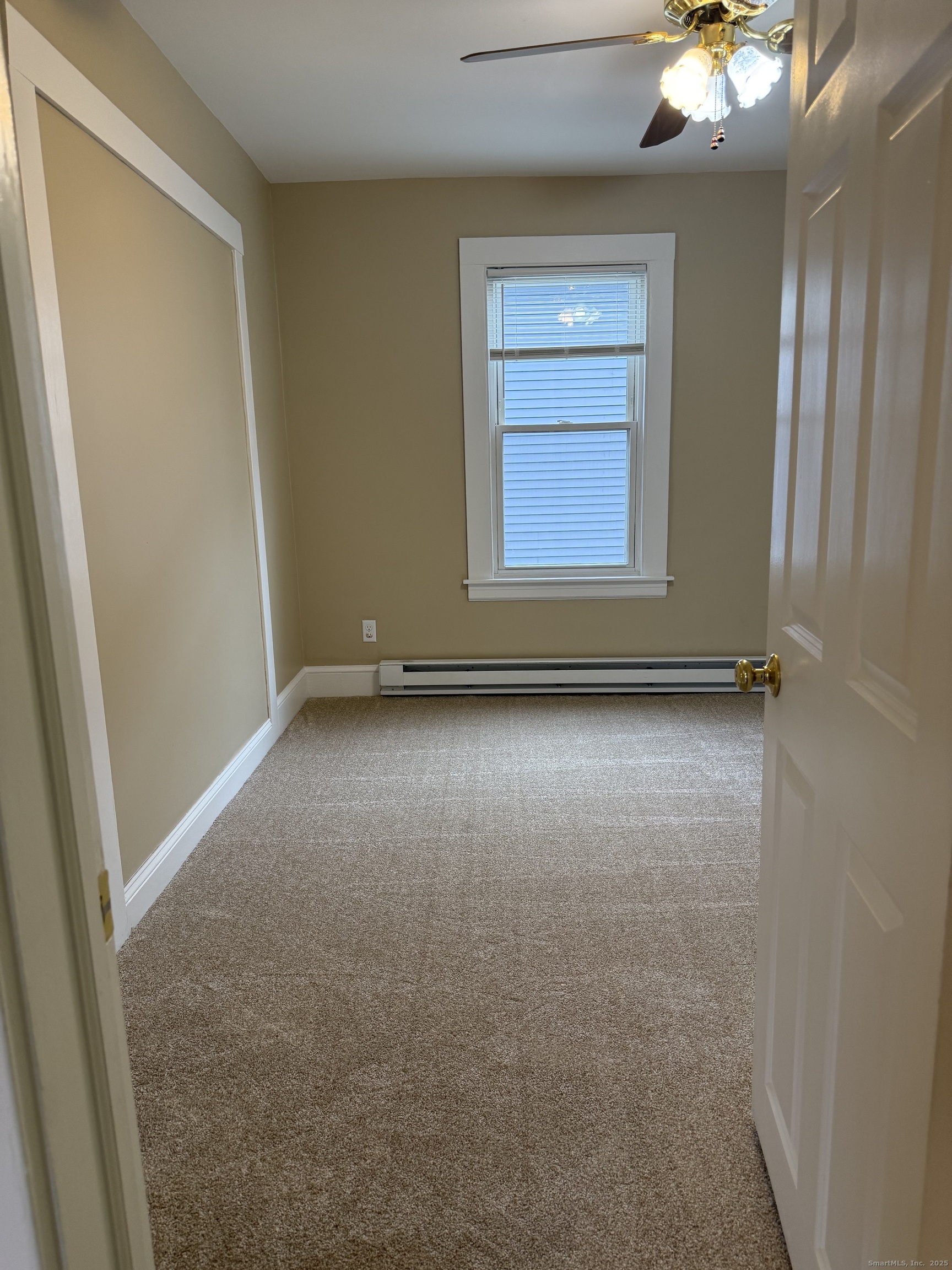 255 Main Street Plymouth, CT 06786 - Photo 6 of 14 an empty room with windows and closet