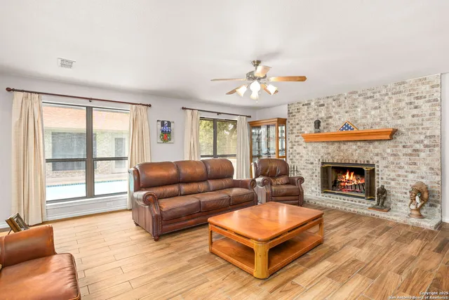 a living room with furniture and a fireplace