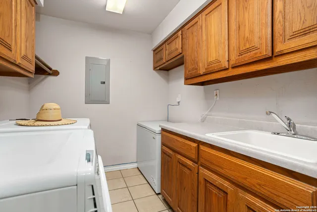 a kitchen with a sink and cabinets