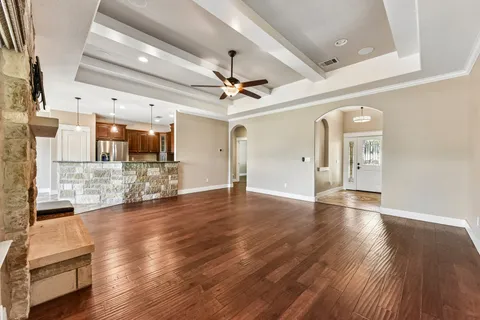 a view of a livingroom with a kitchen