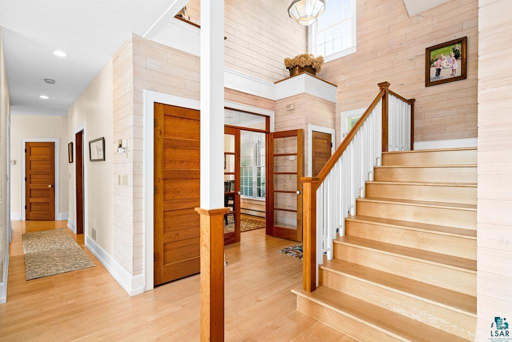 3168 Pioneer Road Barnum, MN 55707 - Photo 4 of 46 Stairs featuring a towering ceiling and hardwood / wood-style floors. Charming yet and elegant, you'll never get tired of the view of this home's interior.