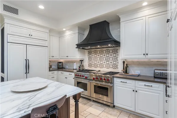 a living room with furniture ceiling fan and a rug