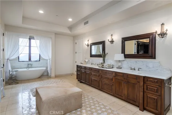 a bathroom with a toilet and a window