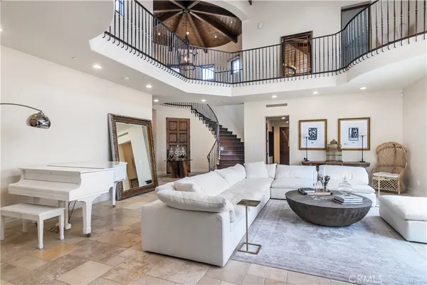 a living room with furniture fireplace and a flat screen tv