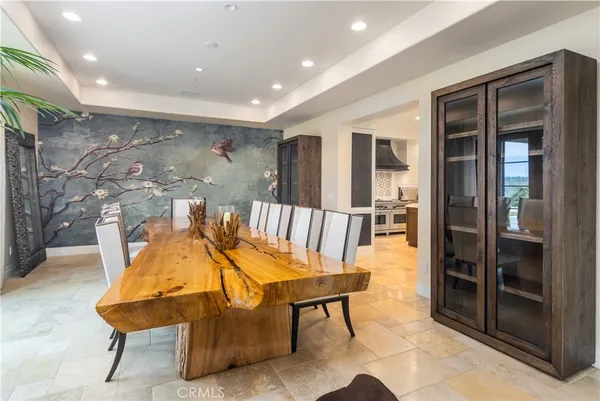 a large kitchen with a table and chairs