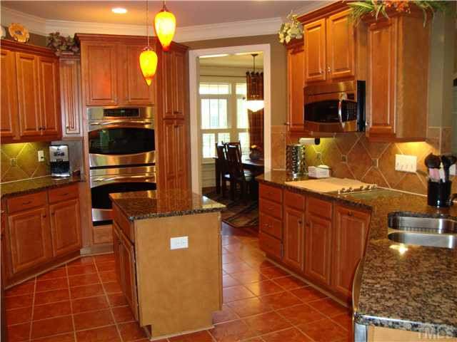 7316 Duncans Ridge Way Fuquay-Varina, NC 27526 - Photo 13 of 25 Another view of Kitchen. This doorway leads to the fomal dining room.